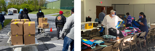 This picture shows First Baptist food distribution event, with several boxes of food stacked up for food bank event. This photo also shows a table filled with backpacks for students.