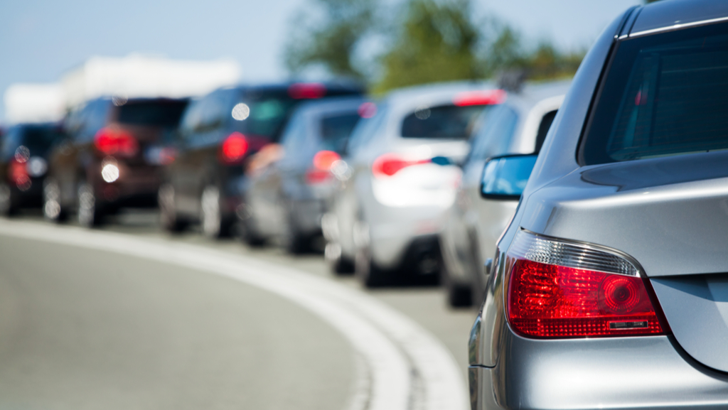 A line of cars gathered in support of a drive through charity event